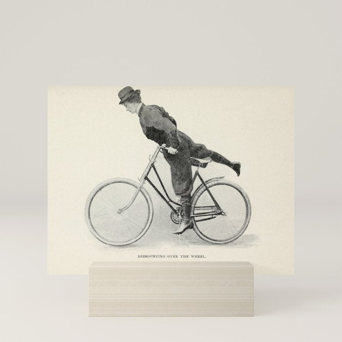 "Dismounting Over the Wheel" from "Bicycling for Ladies" by Maria E. Ward, 1896 Mini Art Print