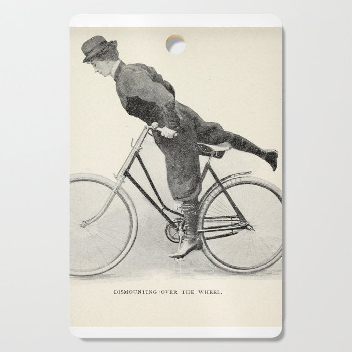 "Dismounting Over the Wheel" from "Bicycling for Ladies" by Maria E. Ward, 1896 Cutting Board