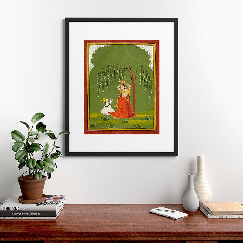 A female attendant is standing in tribhanga pose under a tree. A small child vies for her attention. Framed Art Print