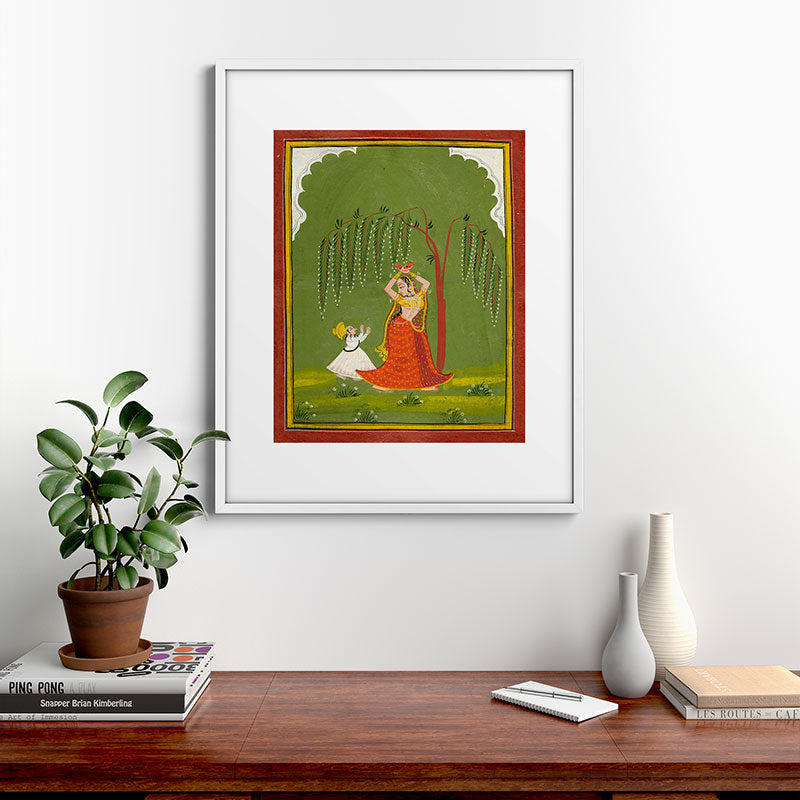 A female attendant is standing in tribhanga pose under a tree. A small child vies for her attention. Framed Art Print