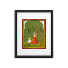 A female attendant is standing in tribhanga pose under a tree. A small child vies for her attention. Framed Art Print