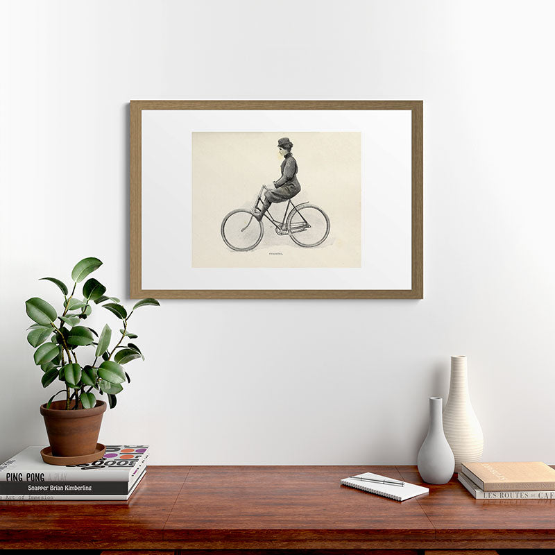 "Coasting" from "Bicycling for Ladies" by Maria E. Ward, 1896 Framed Art Print