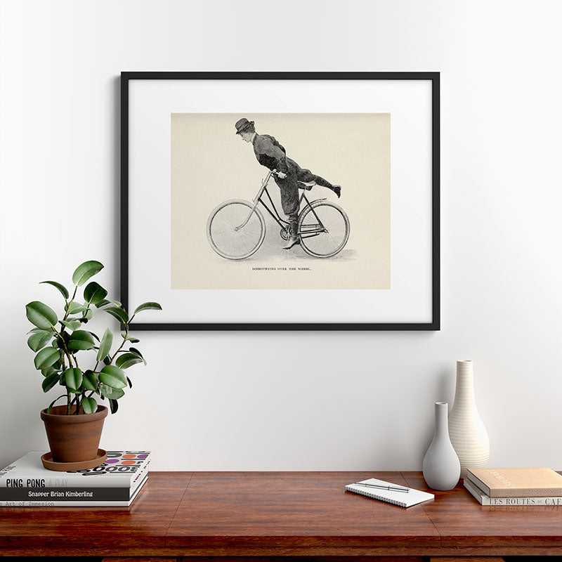 "Dismounting Over the Wheel" from "Bicycling for Ladies" by Maria E. Ward, 1896 Framed Art Print