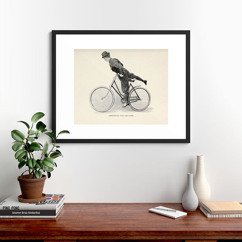 "Dismounting Over the Wheel" from "Bicycling for Ladies" by Maria E. Ward, 1896 Framed Art Print