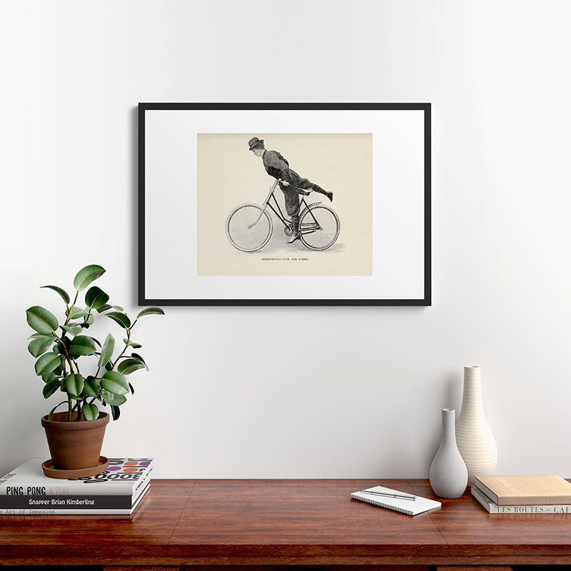 "Dismounting Over the Wheel" from "Bicycling for Ladies" by Maria E. Ward, 1896 Framed Art Print