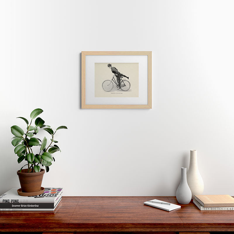 "Dismounting Over the Wheel" from "Bicycling for Ladies" by Maria E. Ward, 1896 Framed Art Print