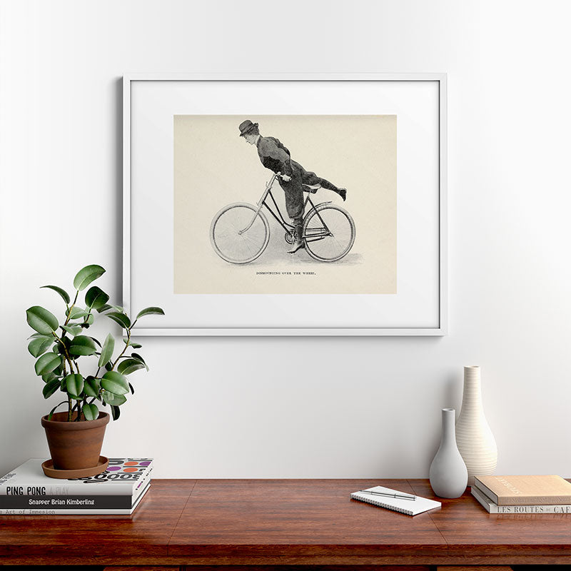 "Dismounting Over the Wheel" from "Bicycling for Ladies" by Maria E. Ward, 1896 Framed Art Print