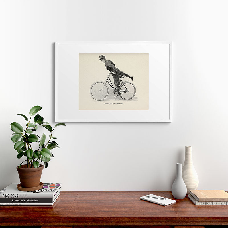 "Dismounting Over the Wheel" from "Bicycling for Ladies" by Maria E. Ward, 1896 Framed Art Print