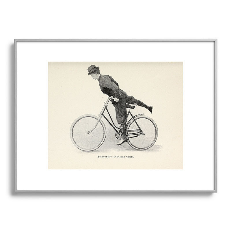 "Dismounting Over the Wheel" from "Bicycling for Ladies" by Maria E. Ward, 1896 Framed Art Print