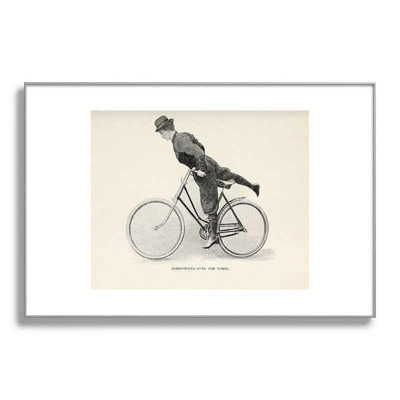 "Dismounting Over the Wheel" from "Bicycling for Ladies" by Maria E. Ward, 1896 Framed Art Print