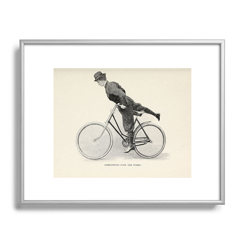 "Dismounting Over the Wheel" from "Bicycling for Ladies" by Maria E. Ward, 1896 Framed Art Print