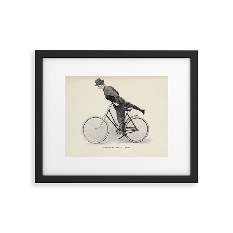 "Dismounting Over the Wheel" from "Bicycling for Ladies" by Maria E. Ward, 1896 Framed Art Print