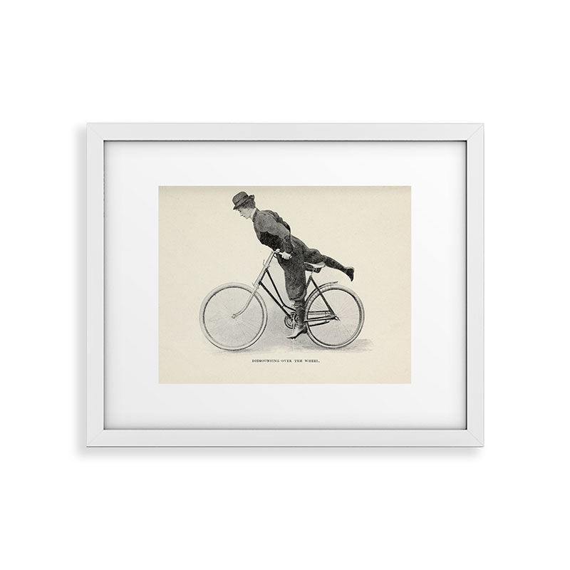 "Dismounting Over the Wheel" from "Bicycling for Ladies" by Maria E. Ward, 1896 Framed Art Print