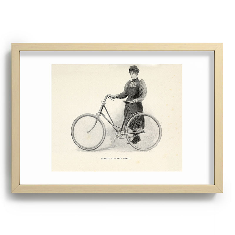 "Leading a Bicycle About" from "Bicycling for Ladies" by Maria E. Ward, 1896 Framed Art Print