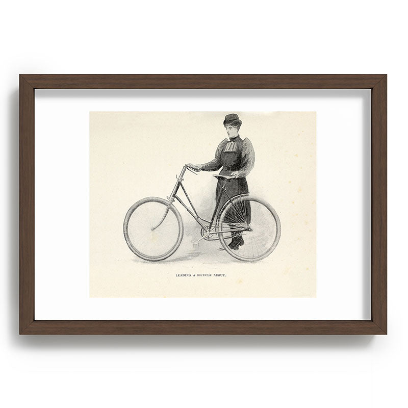 "Leading a Bicycle About" from "Bicycling for Ladies" by Maria E. Ward, 1896 Framed Art Print