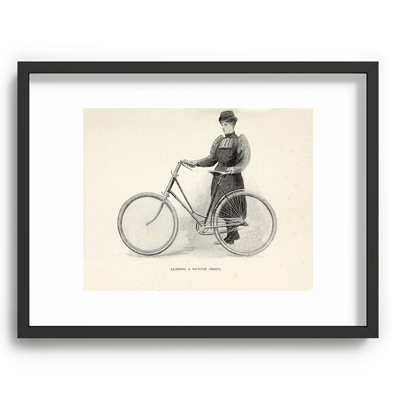 "Leading a Bicycle About" from "Bicycling for Ladies" by Maria E. Ward, 1896 Framed Art Print