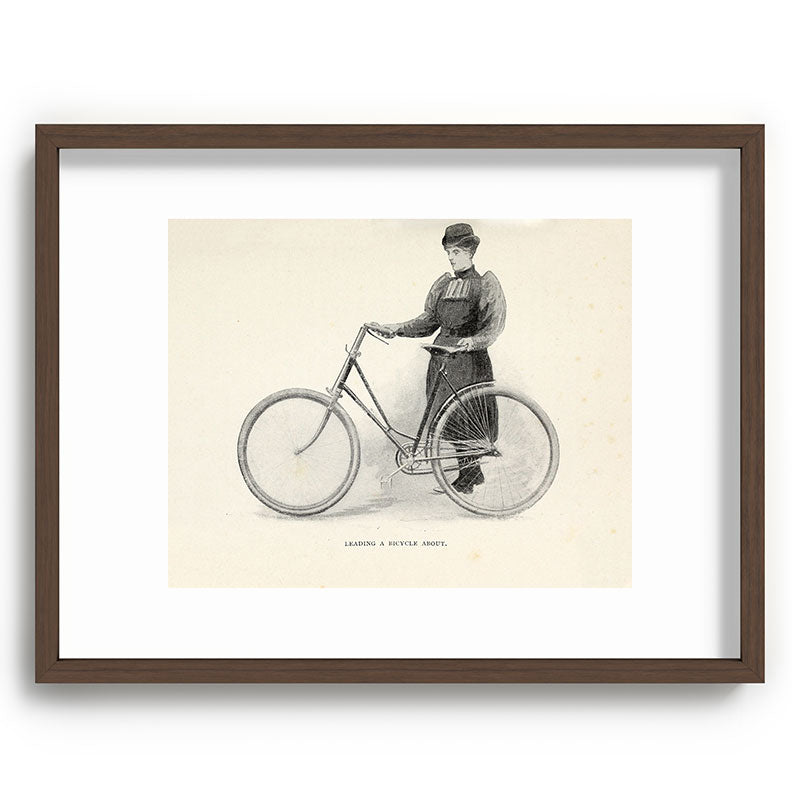 "Leading a Bicycle About" from "Bicycling for Ladies" by Maria E. Ward, 1896 Framed Art Print
