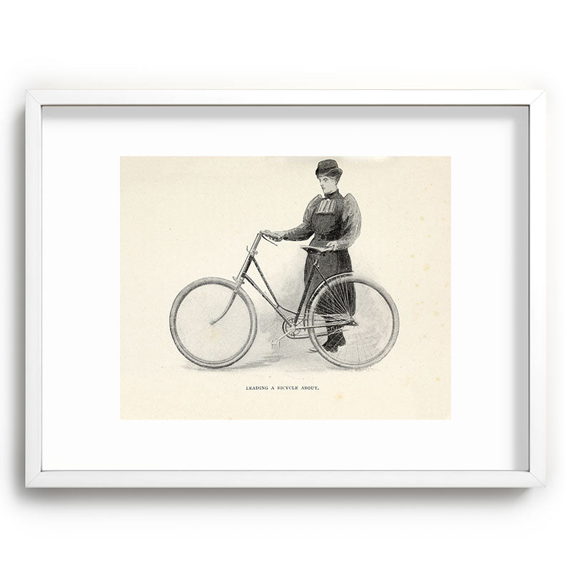 "Leading a Bicycle About" from "Bicycling for Ladies" by Maria E. Ward, 1896 Framed Art Print