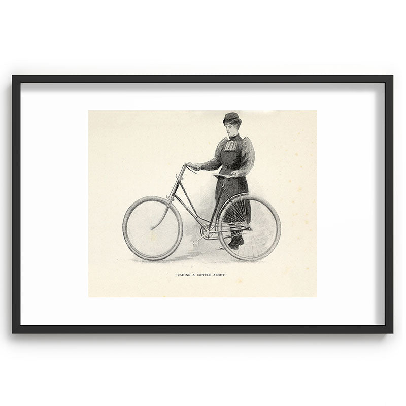 "Leading a Bicycle About" from "Bicycling for Ladies" by Maria E. Ward, 1896 Framed Art Print