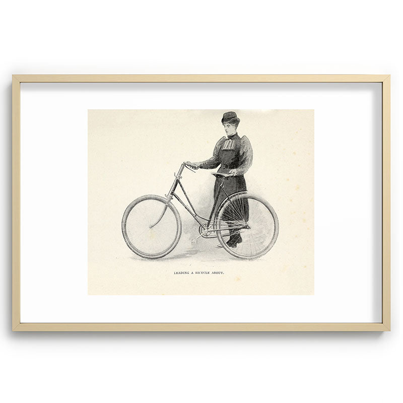 "Leading a Bicycle About" from "Bicycling for Ladies" by Maria E. Ward, 1896 Framed Art Print