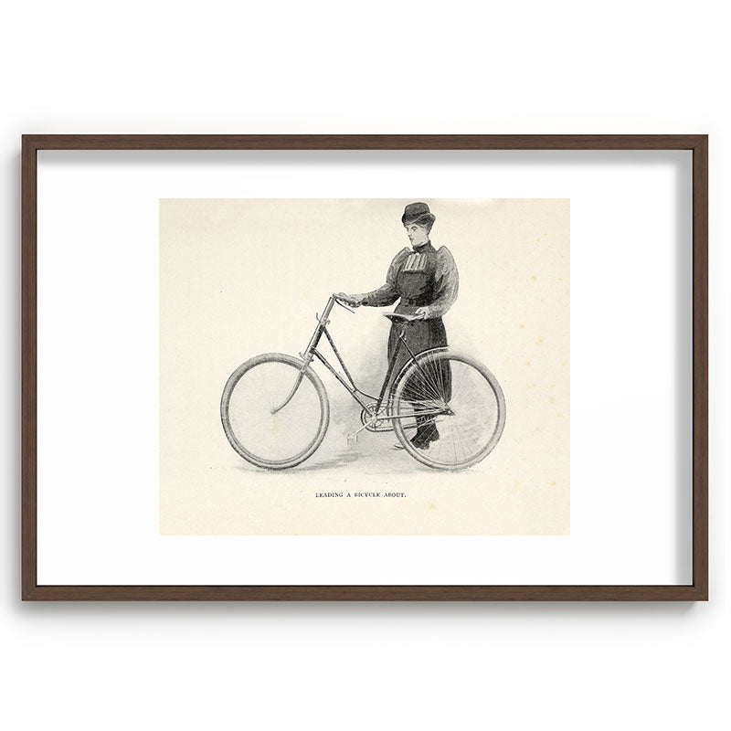"Leading a Bicycle About" from "Bicycling for Ladies" by Maria E. Ward, 1896 Framed Art Print