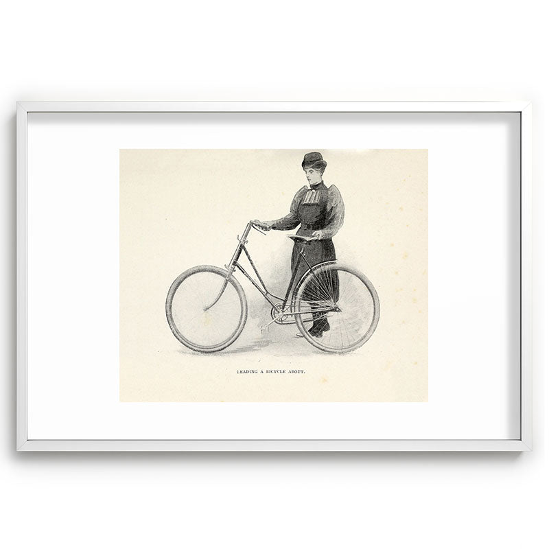 "Leading a Bicycle About" from "Bicycling for Ladies" by Maria E. Ward, 1896 Framed Art Print