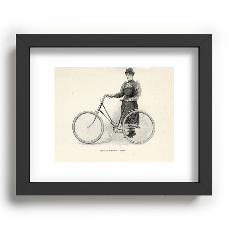 "Leading a Bicycle About" from "Bicycling for Ladies" by Maria E. Ward, 1896 Framed Art Print