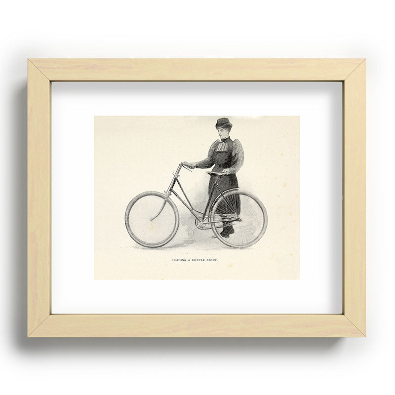 "Leading a Bicycle About" from "Bicycling for Ladies" by Maria E. Ward, 1896 Framed Art Print