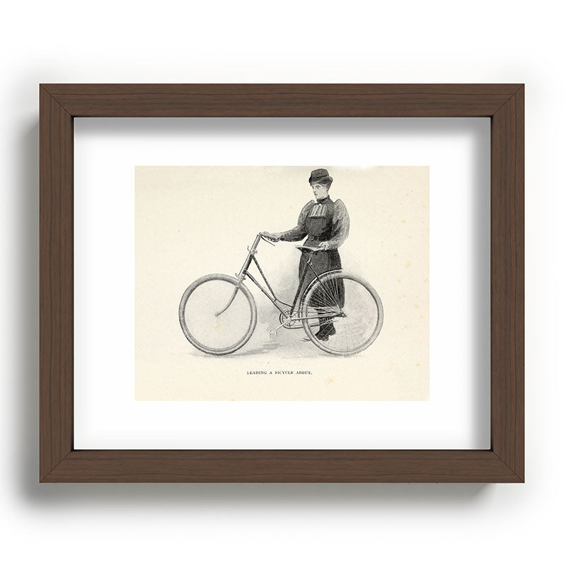 "Leading a Bicycle About" from "Bicycling for Ladies" by Maria E. Ward, 1896 Framed Art Print
