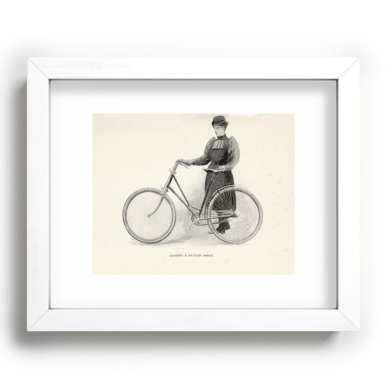 "Leading a Bicycle About" from "Bicycling for Ladies" by Maria E. Ward, 1896 Framed Art Print