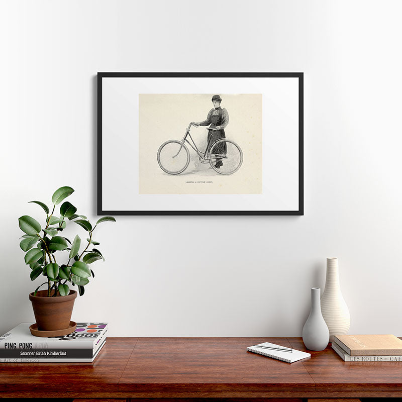 "Leading a Bicycle About" from "Bicycling for Ladies" by Maria E. Ward, 1896 Framed Art Print
