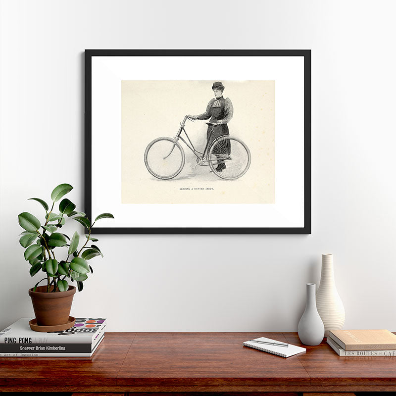 "Leading a Bicycle About" from "Bicycling for Ladies" by Maria E. Ward, 1896 Framed Art Print