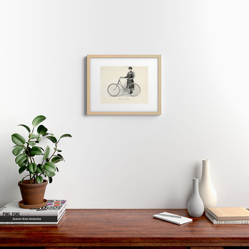 "Leading a Bicycle About" from "Bicycling for Ladies" by Maria E. Ward, 1896 Framed Art Print