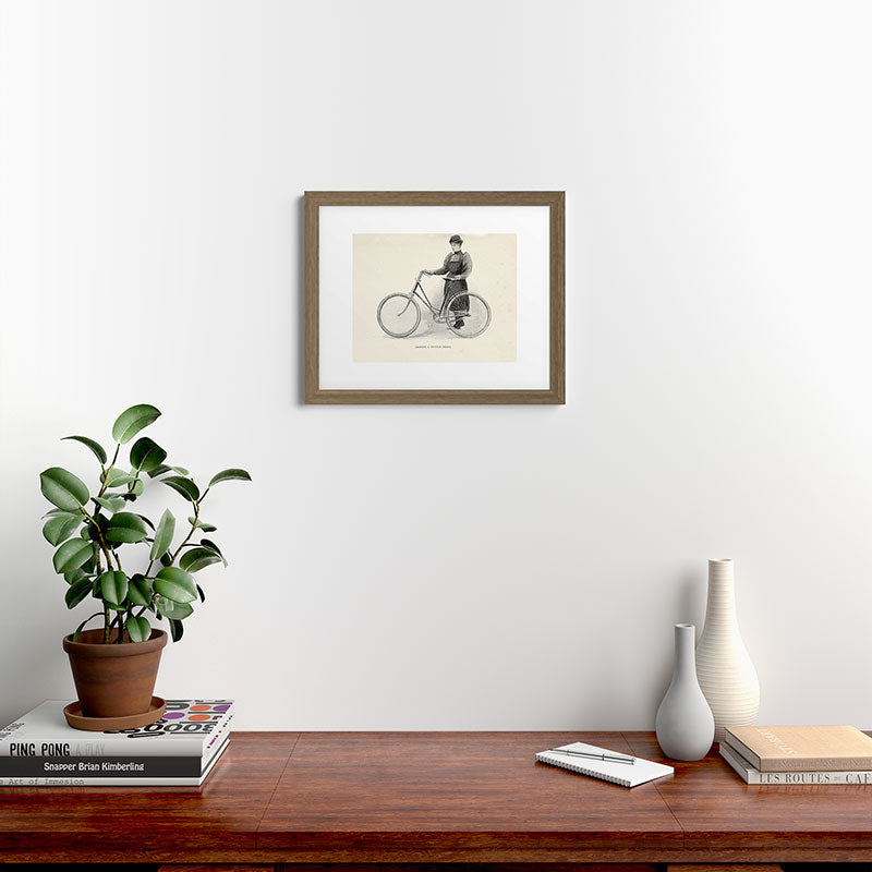 "Leading a Bicycle About" from "Bicycling for Ladies" by Maria E. Ward, 1896 Framed Art Print