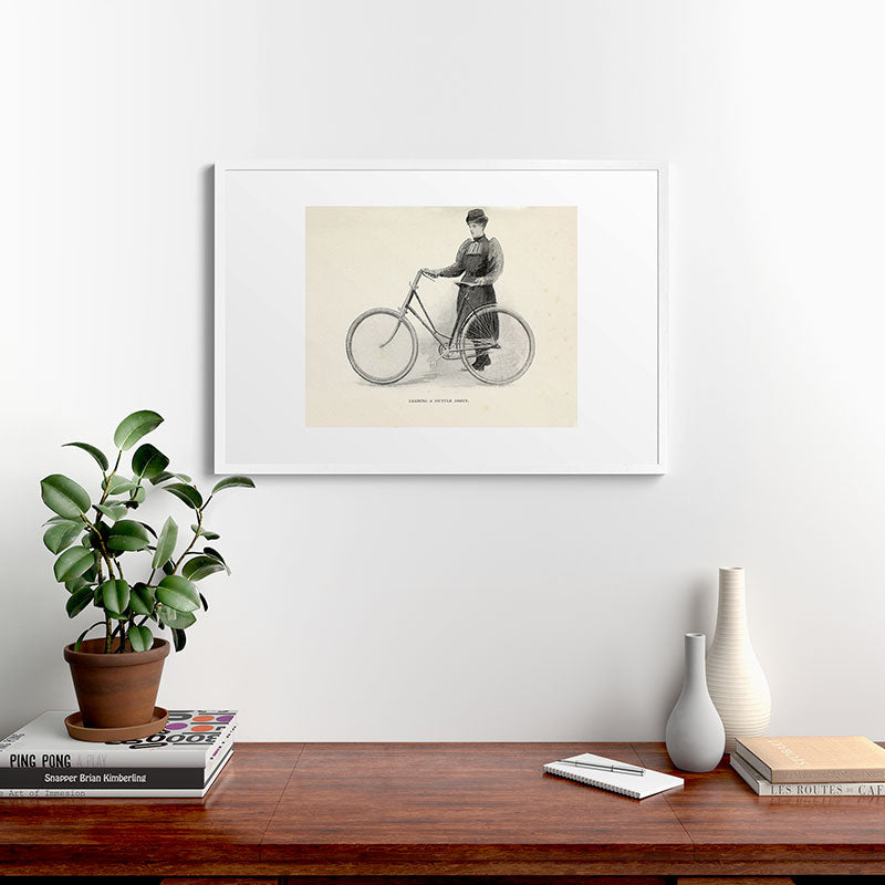 "Leading a Bicycle About" from "Bicycling for Ladies" by Maria E. Ward, 1896 Framed Art Print