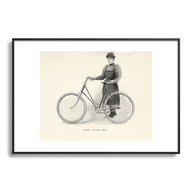 "Leading a Bicycle About" from "Bicycling for Ladies" by Maria E. Ward, 1896 Framed Art Print