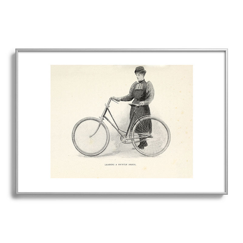 "Leading a Bicycle About" from "Bicycling for Ladies" by Maria E. Ward, 1896 Framed Art Print