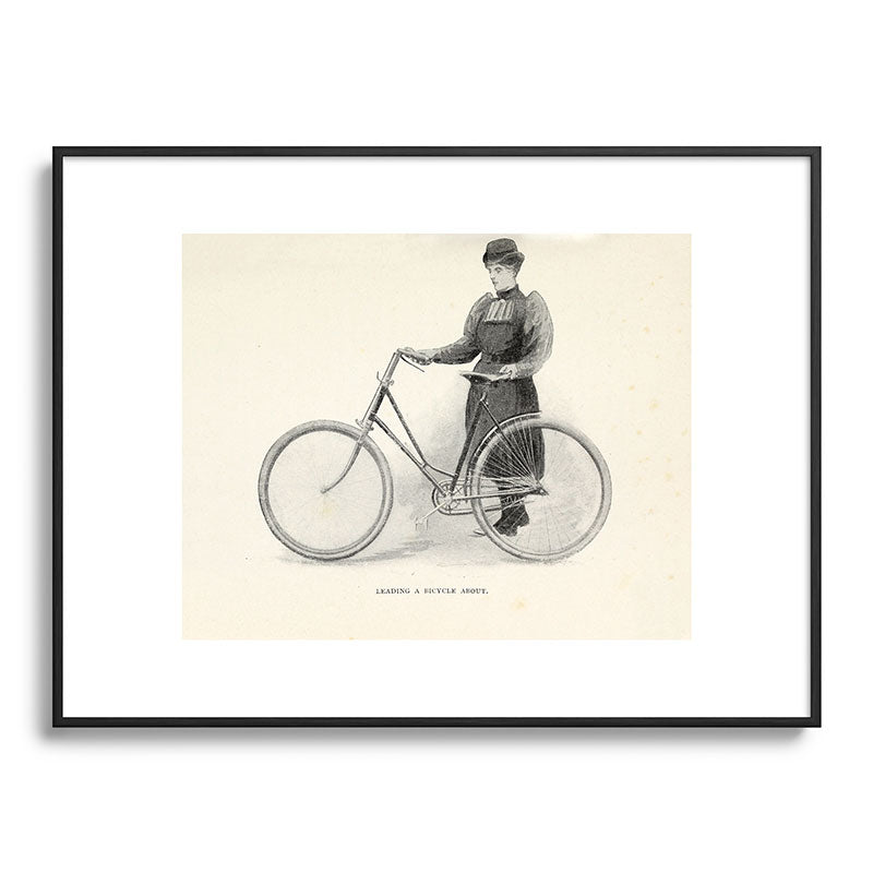 "Leading a Bicycle About" from "Bicycling for Ladies" by Maria E. Ward, 1896 Framed Art Print