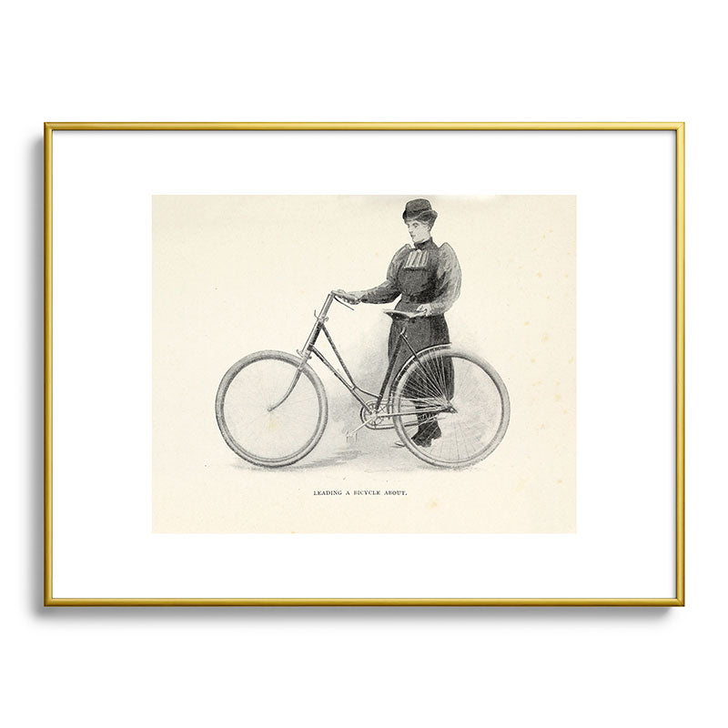 "Leading a Bicycle About" from "Bicycling for Ladies" by Maria E. Ward, 1896 Framed Art Print