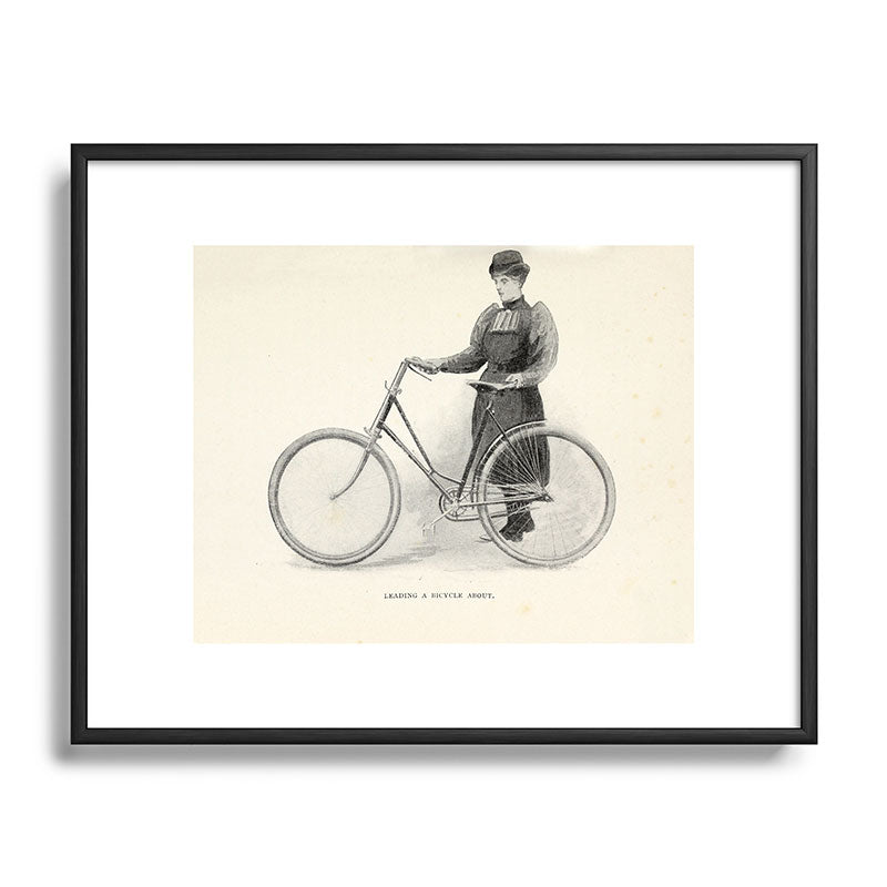 "Leading a Bicycle About" from "Bicycling for Ladies" by Maria E. Ward, 1896 Framed Art Print