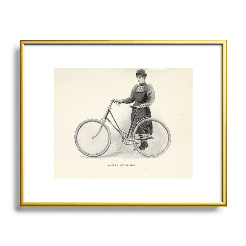 "Leading a Bicycle About" from "Bicycling for Ladies" by Maria E. Ward, 1896 Framed Art Print