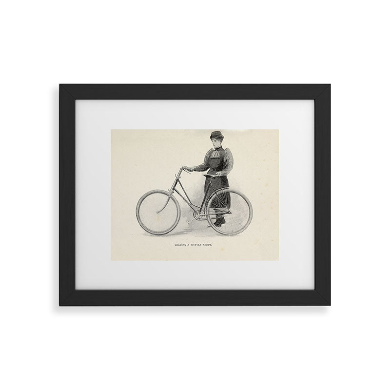 "Leading a Bicycle About" from "Bicycling for Ladies" by Maria E. Ward, 1896 Framed Art Print