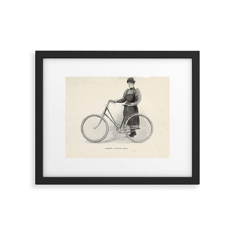 "Leading a Bicycle About" from "Bicycling for Ladies" by Maria E. Ward, 1896 Framed Art Print