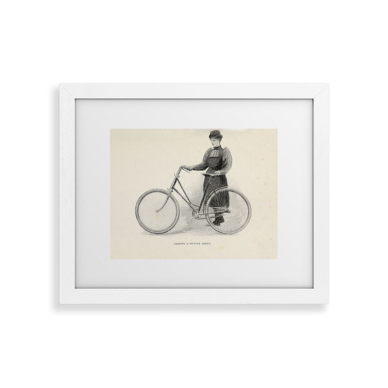 "Leading a Bicycle About" from "Bicycling for Ladies" by Maria E. Ward, 1896 Framed Art Print