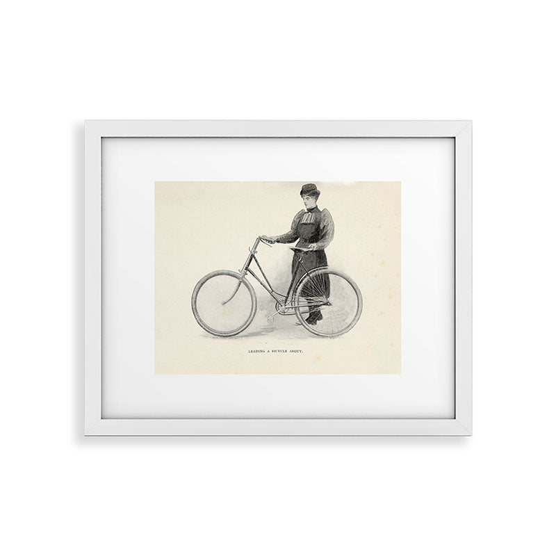 "Leading a Bicycle About" from "Bicycling for Ladies" by Maria E. Ward, 1896 Framed Art Print
