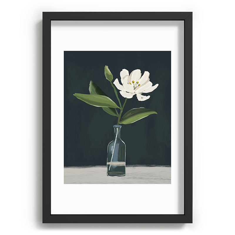 A flower in a vase Framed Art Print