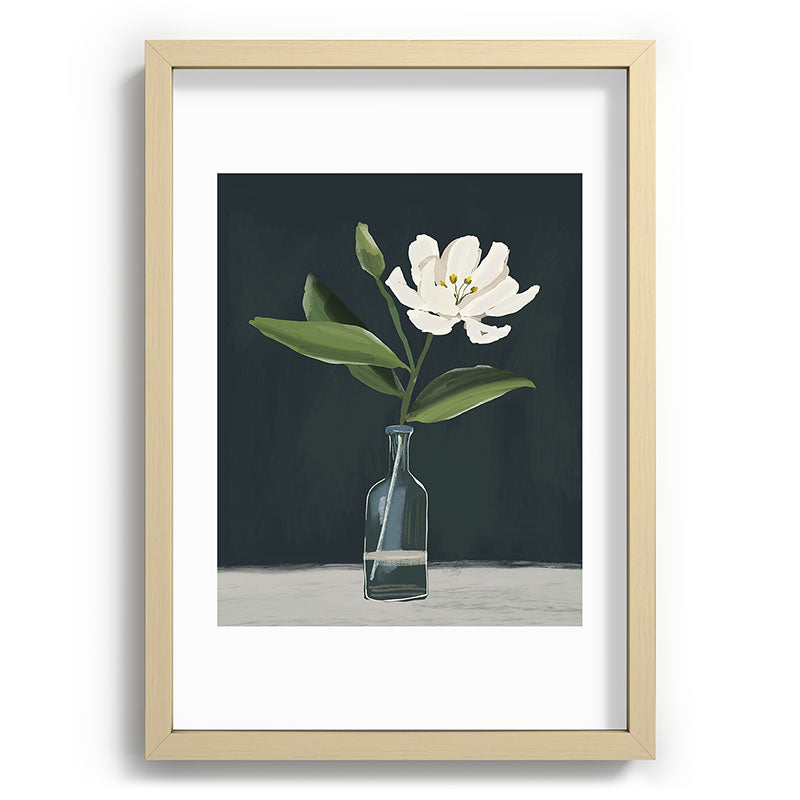 A flower in a vase Framed Art Print