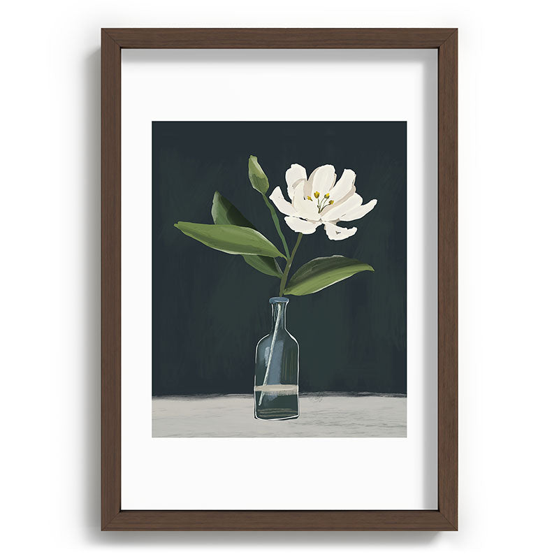 A flower in a vase Framed Art Print