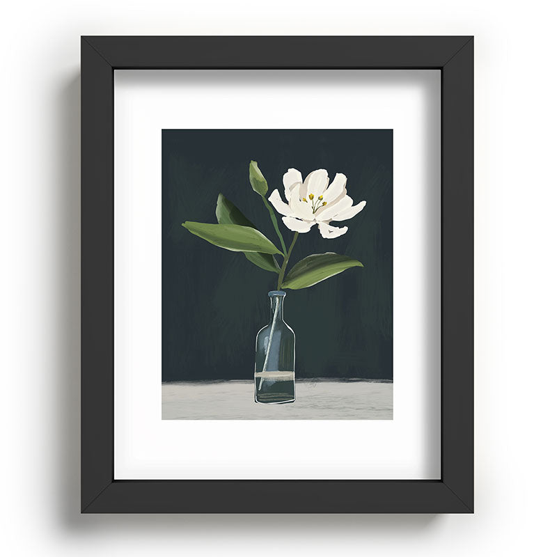 A flower in a vase Framed Art Print