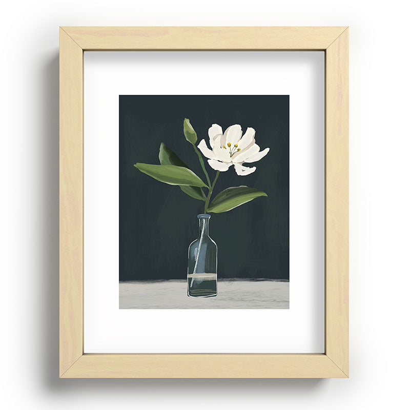 A flower in a vase Framed Art Print